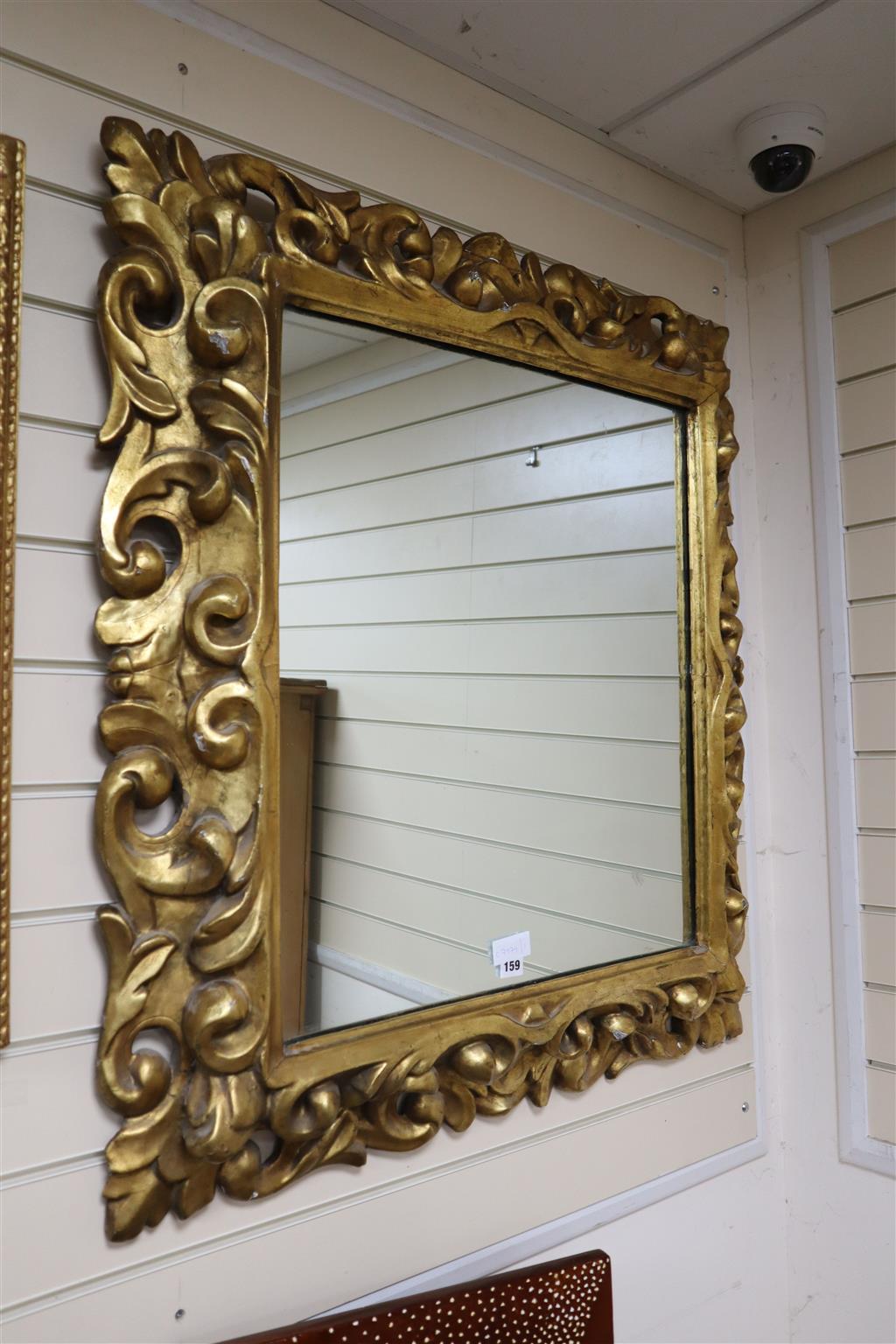 A 19th century carved Neapolitan style wall mirror, width 84cm, height 94cm